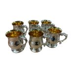 A set of six Sterling silver mugs with gilt interiors by Camelot Silverware Ltd, Sheffield 1994,