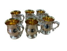 A set of six Sterling silver mugs with gilt interiors by Camelot Silverware Ltd, Sheffield 1994,