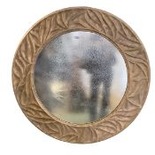 A contemporary circular wall mirror, the frame of modern foliate design