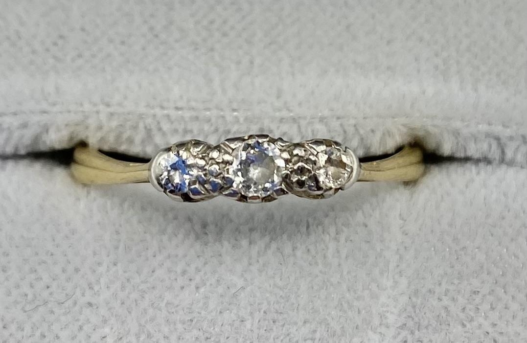 An 18ct gold and diamond three stone ring. 2.26g. Size O. - Image 2 of 3