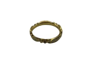An unmarked yellow metal and white enamel mourning ring stamped to inside of hoop EC, Rich Taylar OB