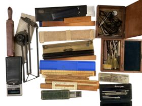 A quantity of drawing instruments, rulers, boxes, and all as found, see images