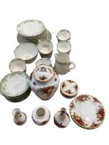 A quantity of Country Roses China (no damage), and a green and white tea set (some cracks and