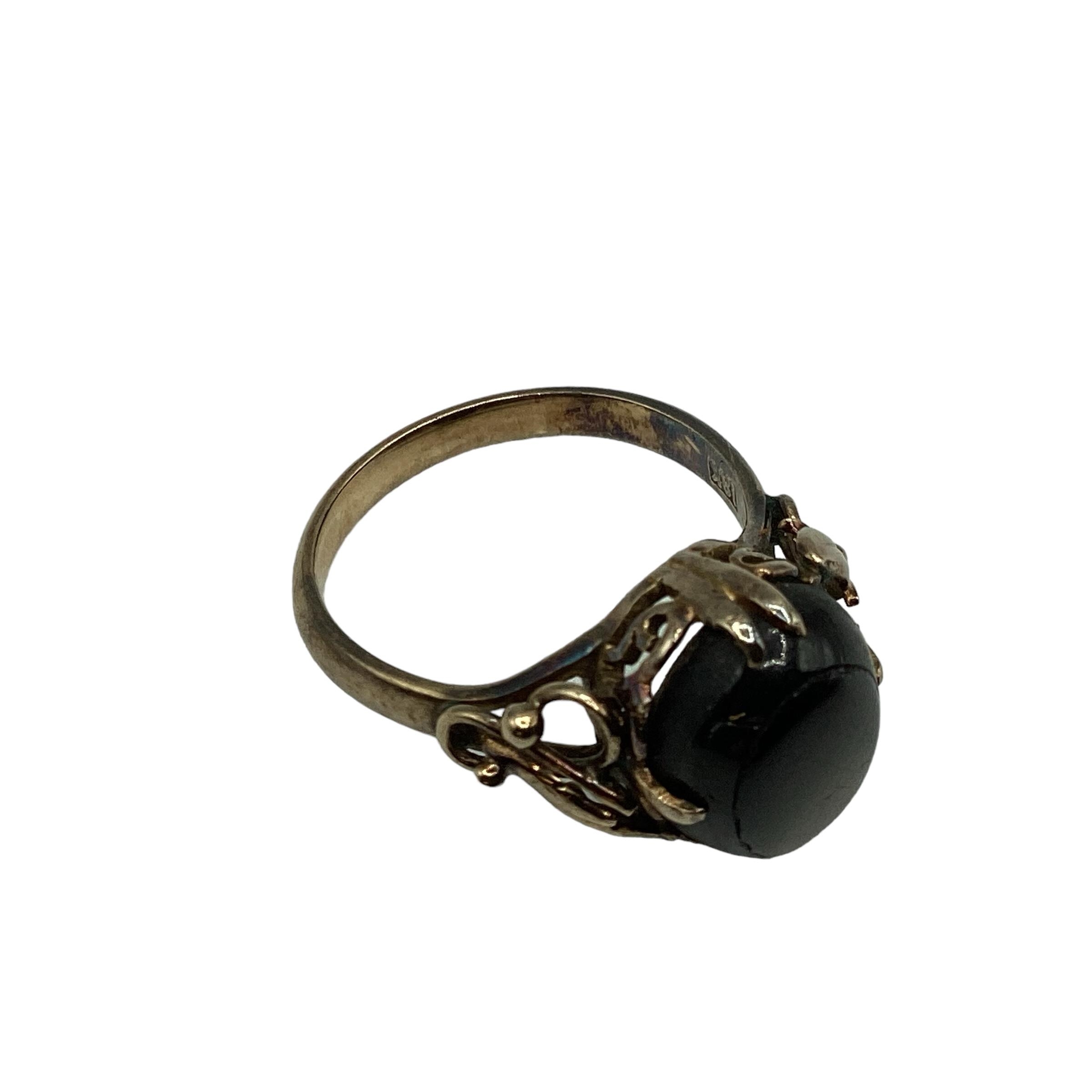 An 18ct gold black star sapphire set ladies dress ring, with scrolling floral shoulders, 4.06 g, - Image 3 of 4