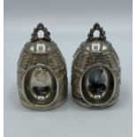 A pair of Chinese white metal ceremonial bells. Marks to base. 63,5g.