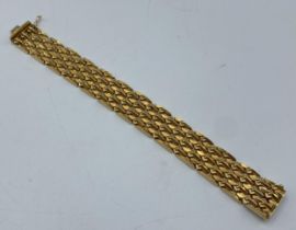 An 18ct gold buckle bracelet, 49g