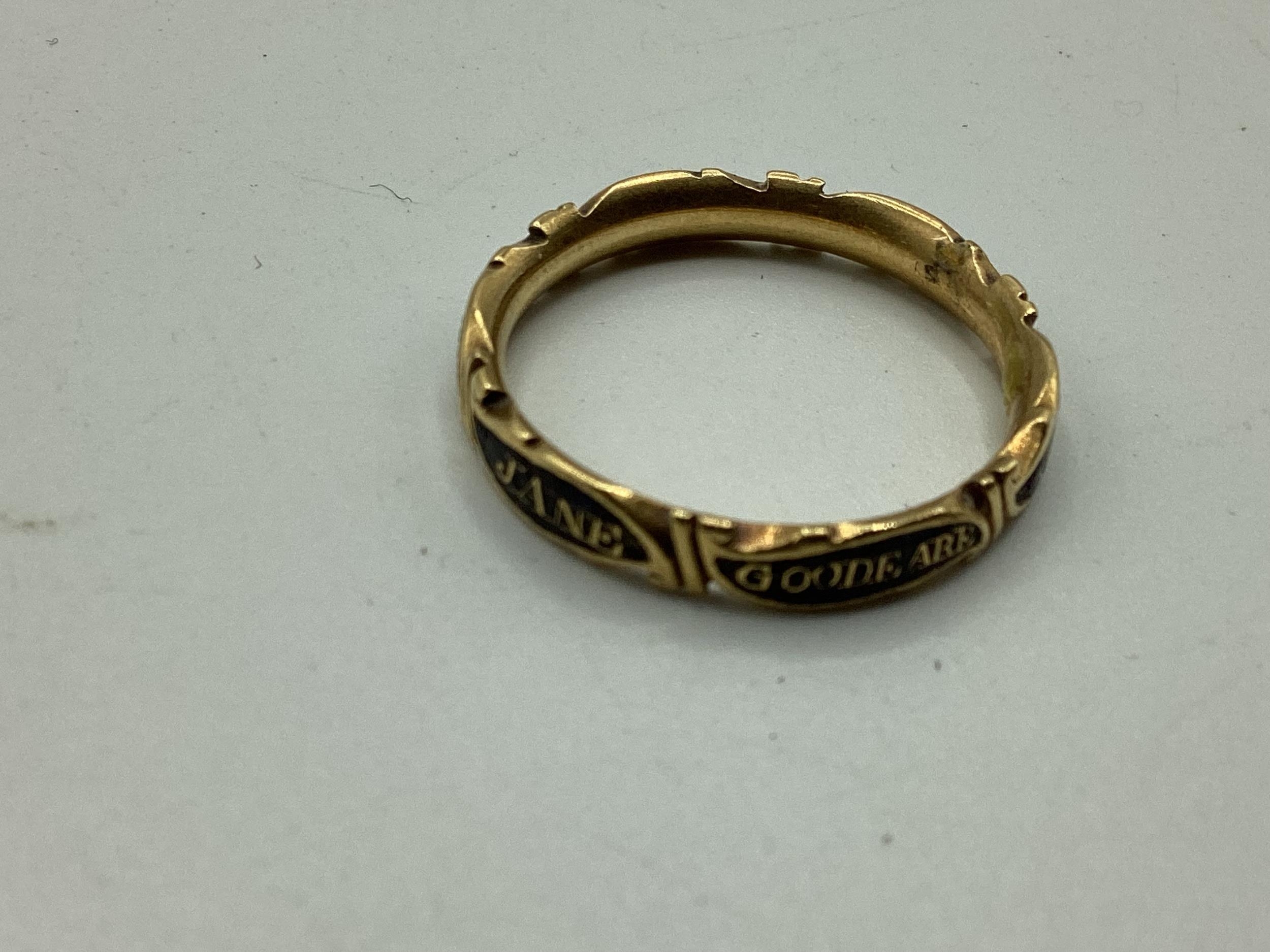 An unmarked yellow metal and black enamel mourning ring, marked CC to inside of hoop, Jane Goodear - Image 2 of 3