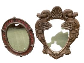 A carved pak cartouche shaped wall mirror, 76 x 58cm overall; and an oval heavy wall mirror with