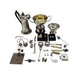 A collection of silver and white metal items