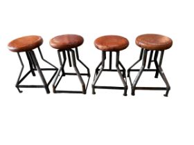 Set of four contemporary leather topped adjustable metal stools.