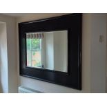A decorative hanging wall mirror, in ornate scrolling cream frame, 121cmH x 80cmw; and a dark framed