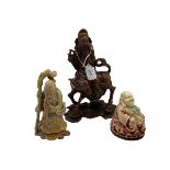 A collection of Oriental items to include a hard stone carving of an immortal a seated Buddha etc.
