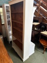 A tall cream painted and pine bookcase, with adjustable shelves, 91W x 198cm H approx