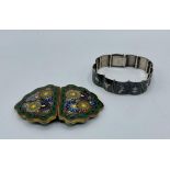 A Japanese Cloisonné belt buckle, Meiji Period together with a Siam silver panel bracelet.