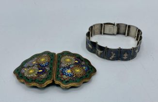 A Japanese Cloisonné belt buckle, Meiji Period together with a Siam silver panel bracelet.