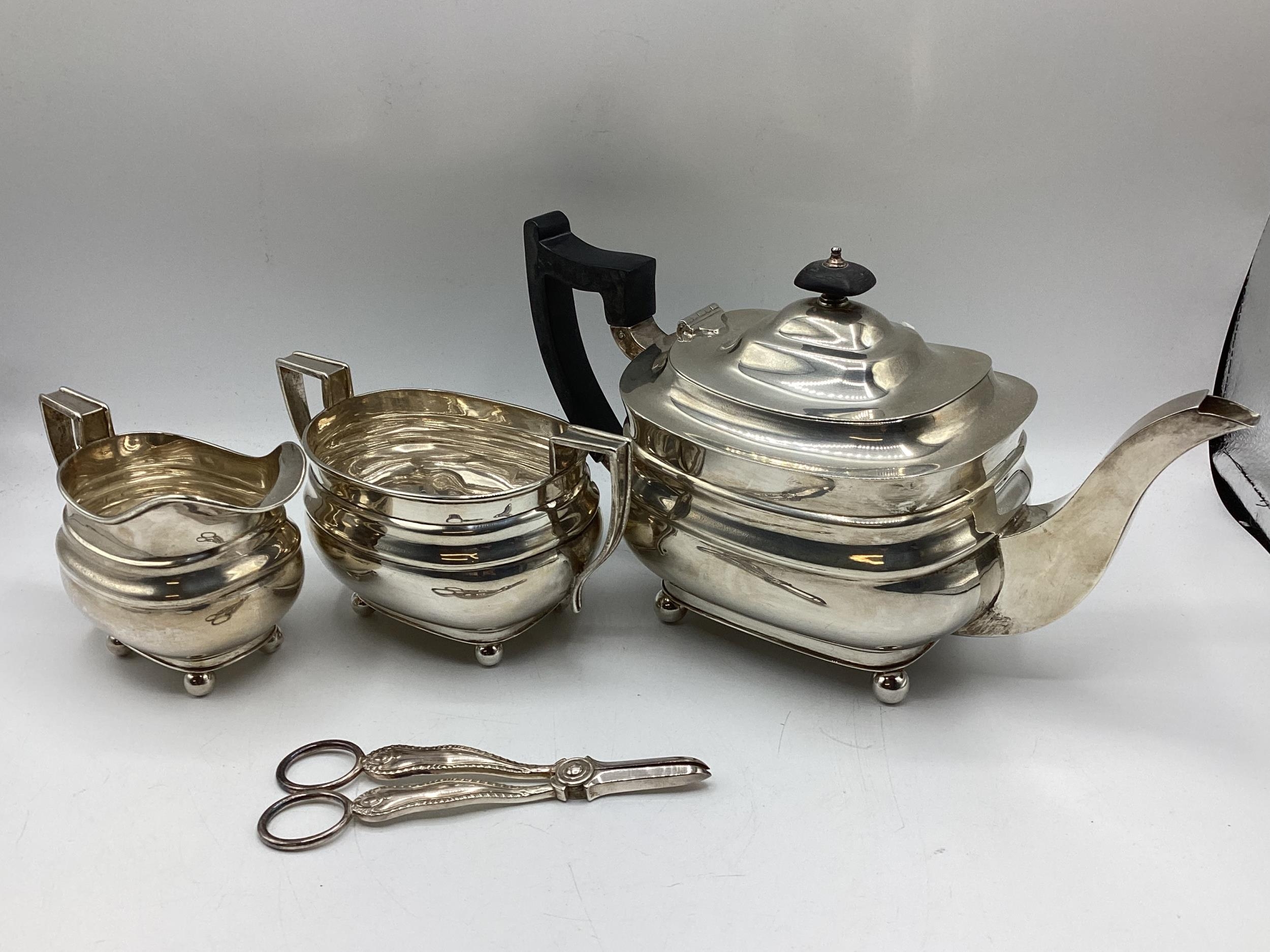 A sterling silver three piece tea set, Walker & Hall Sheffield, 40 ozt - Image 6 of 12