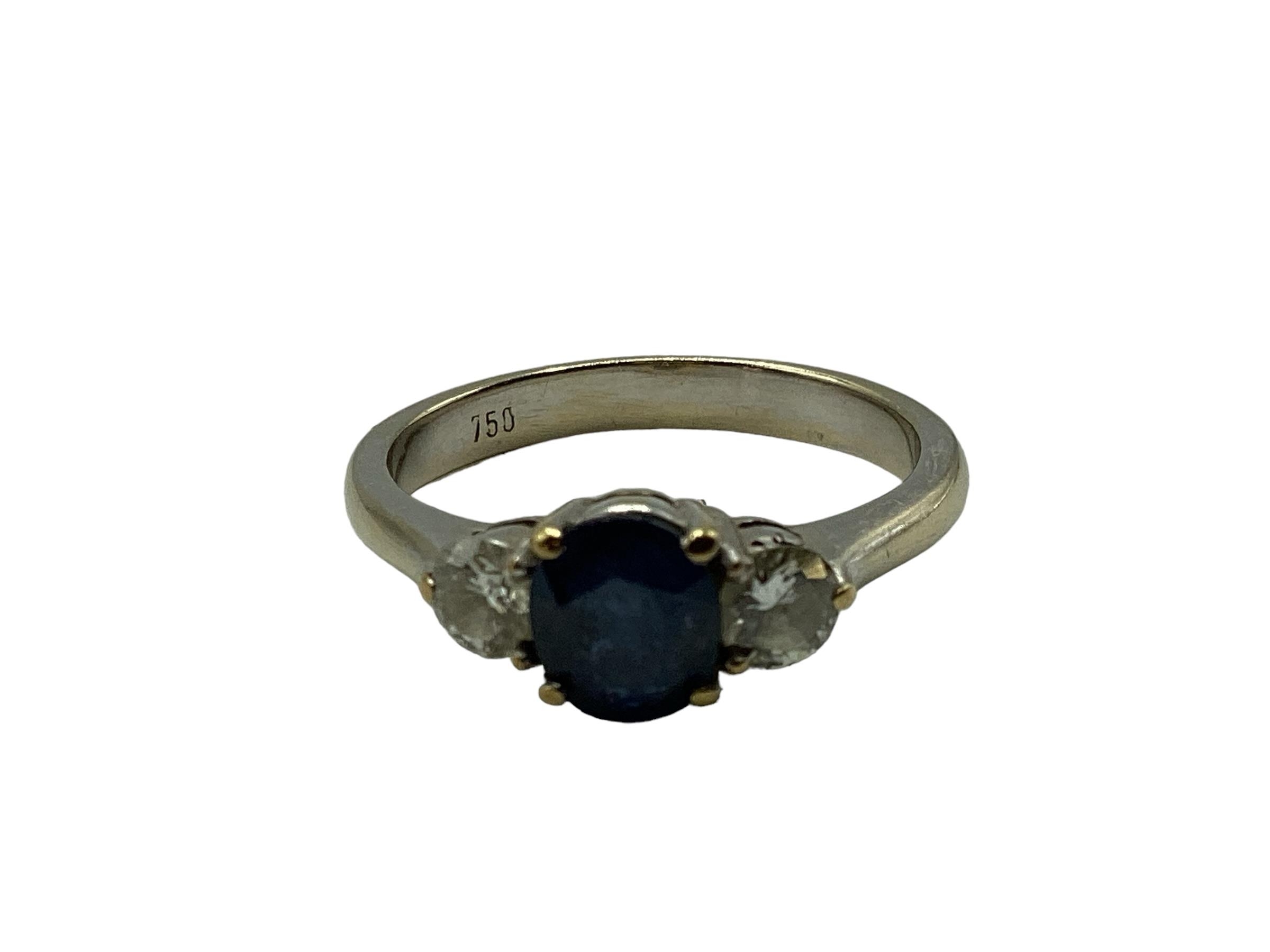 An 18ct white gold sapphire and diamond ring central oval free cut sapphire with brilliant cut - Image 2 of 4