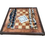 A modern Chess board with novel cat and dog chess pieces