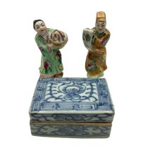 Two Chinese polychrome figures together with a small blue and white ceramic lidded box with gilt