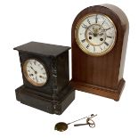 A mahogany cased clock and a black slate mantel clock