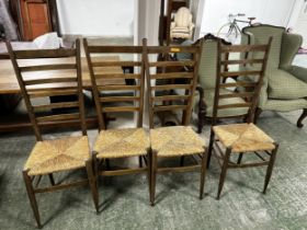 A set of four high backed rush seated chairs, 114cm High. rush seats in generally good order