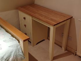 A modern cream and pine effect knee hole desk , 3 drawers, 107cm W, 77cm H; a small chest of 3