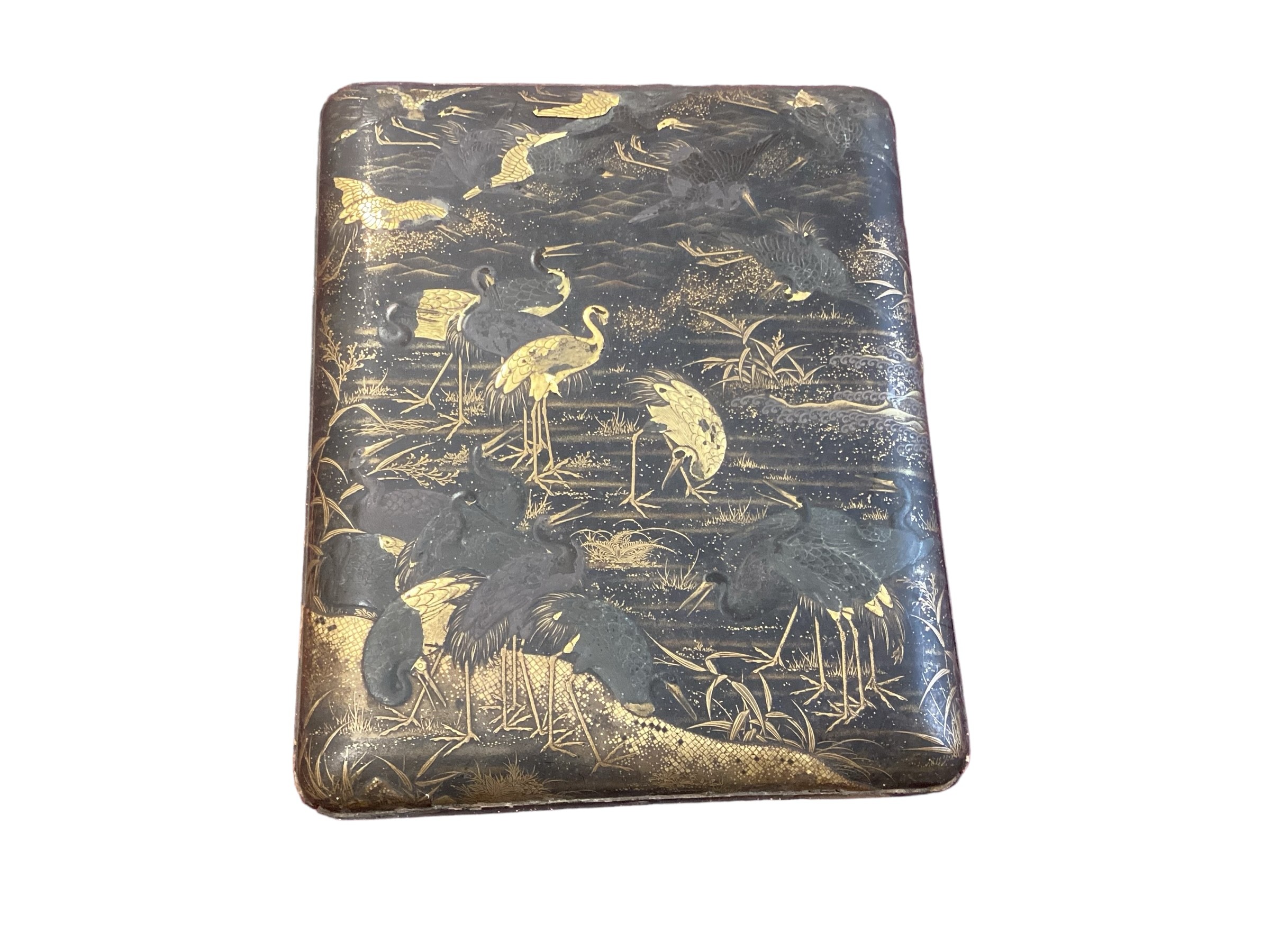 Japanese lacquered writing / painting box depicting cranes. Condition, cracks to lid see photos