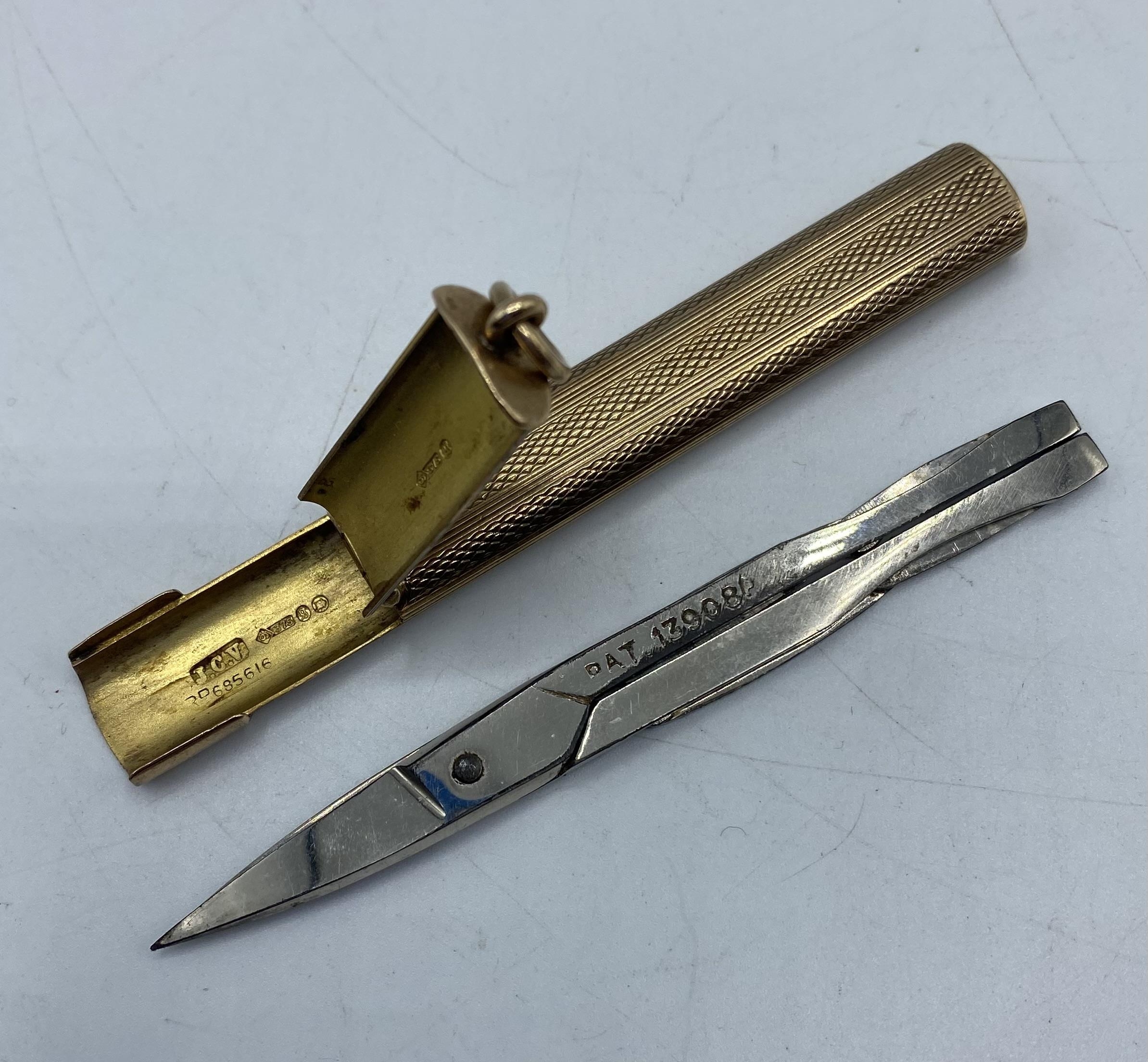 A 9ct gold engine turned etui containing collapsible stainless steel scissors. Case weight. 14.70g. - Image 2 of 6