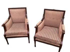 A pair of large square mahogany framed armchairs with brown striped upholstery