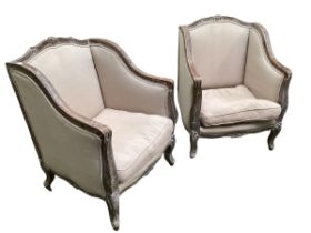 A good pair of modern French style upholstered and painted large high back deep seated arm chairs