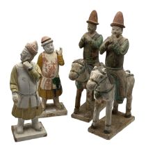 Four Chinese glazed pottery tomb figures in the Ming Dynasty style. A pair of horses and riders