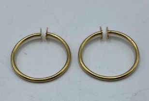 A pair of 18ct gold clip hoop earrings. 6.00g.