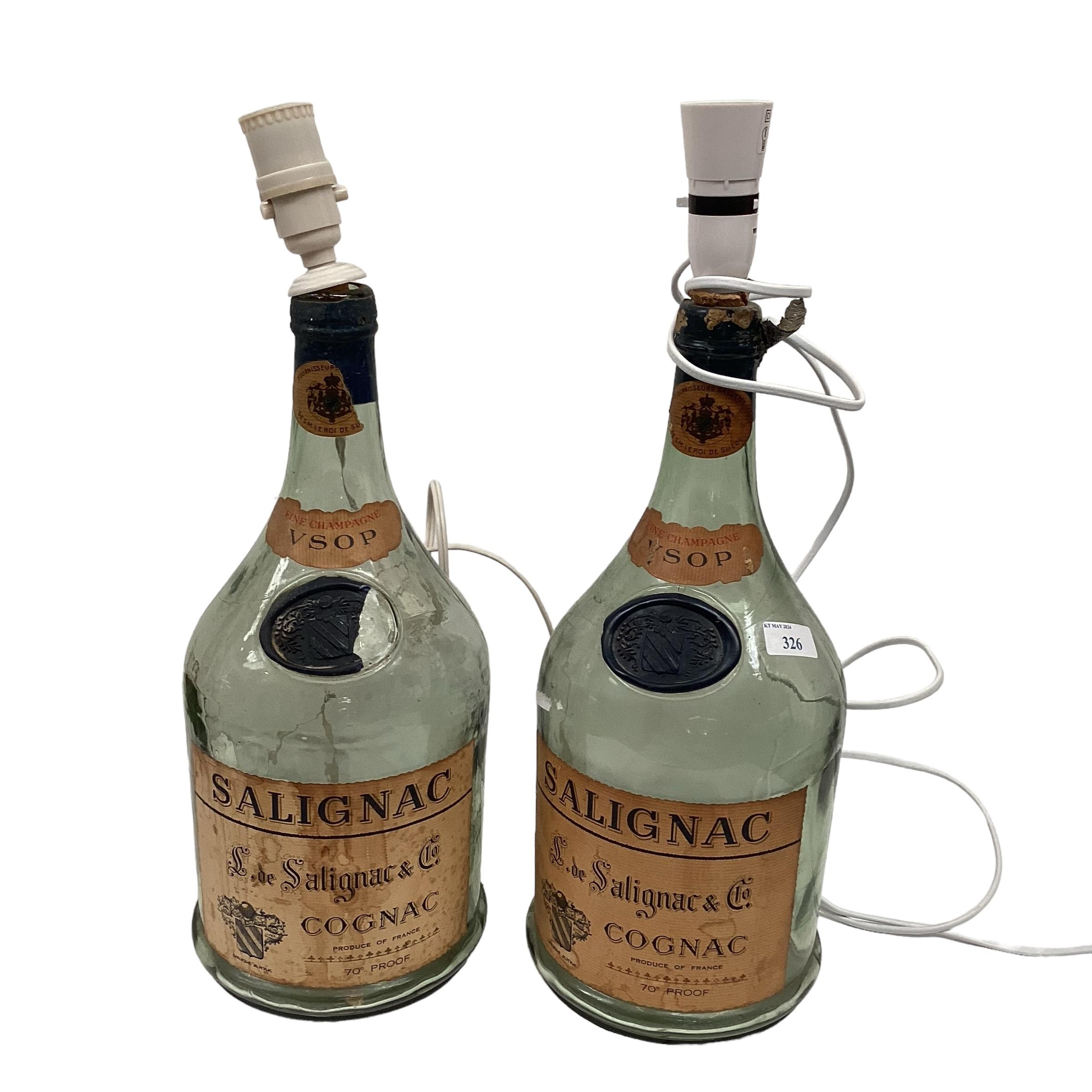 A pair of large lamp bases, designed from old Cognac bottles