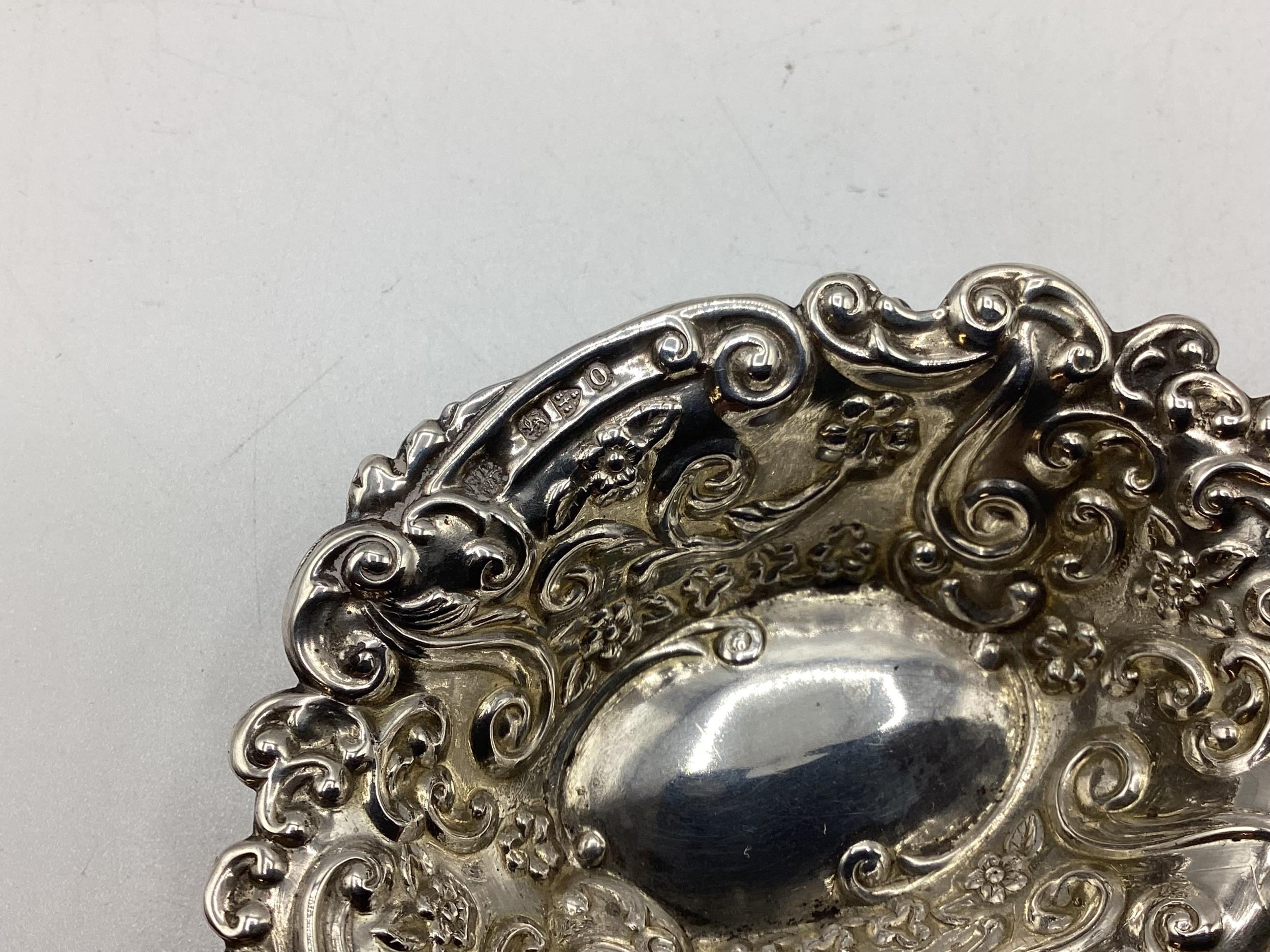 A collection of sterling silver items to include napkin rings , picture frames condiments etc. Gross - Image 13 of 15