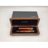 A Parker Duofold Special Edition Orange Fountain pen and ball point, with original case.