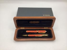 A Parker Duofold Special Edition Orange Fountain pen and ball point, with original case.
