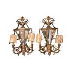 A pair of late C19th wall sconces, with mirrored backs and carved wooden gilded all over design,