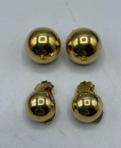 Two pairs of similar 18ct gold clip earrings. 13.7g