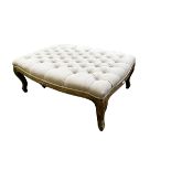 A modern Oka style foot stool with buttoned upholstery, 105 x 74cm