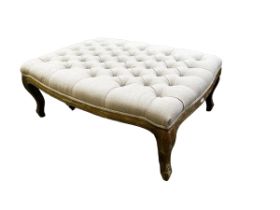 A modern Oka style foot stool with buttoned upholstery, 105 x 74cm