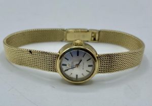 A 9ct gold cased Omega automatic deVille on a 14ct gold bracelet strap. 25g.