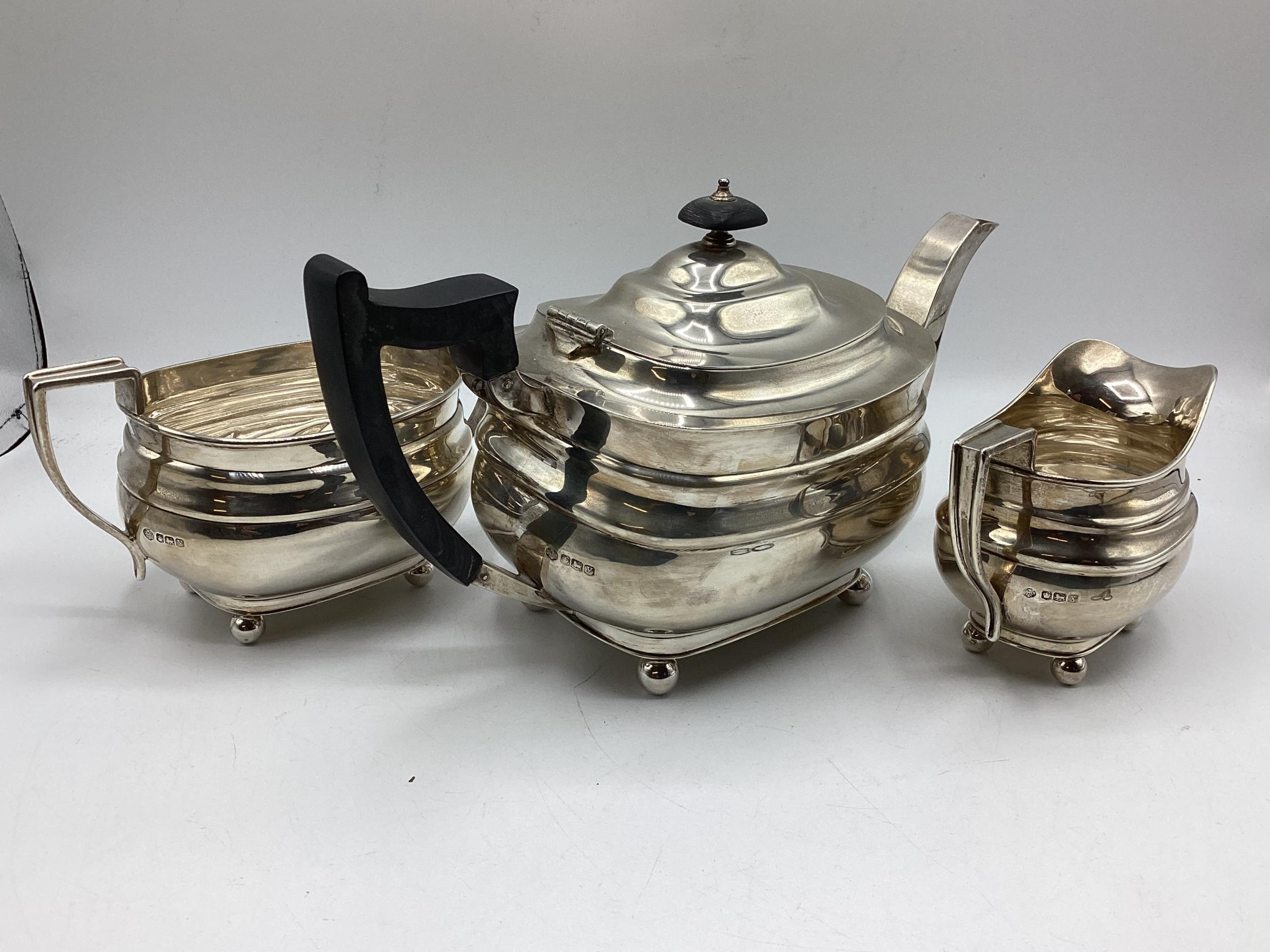 A sterling silver three piece tea set, Walker & Hall Sheffield, 40 ozt - Image 2 of 12
