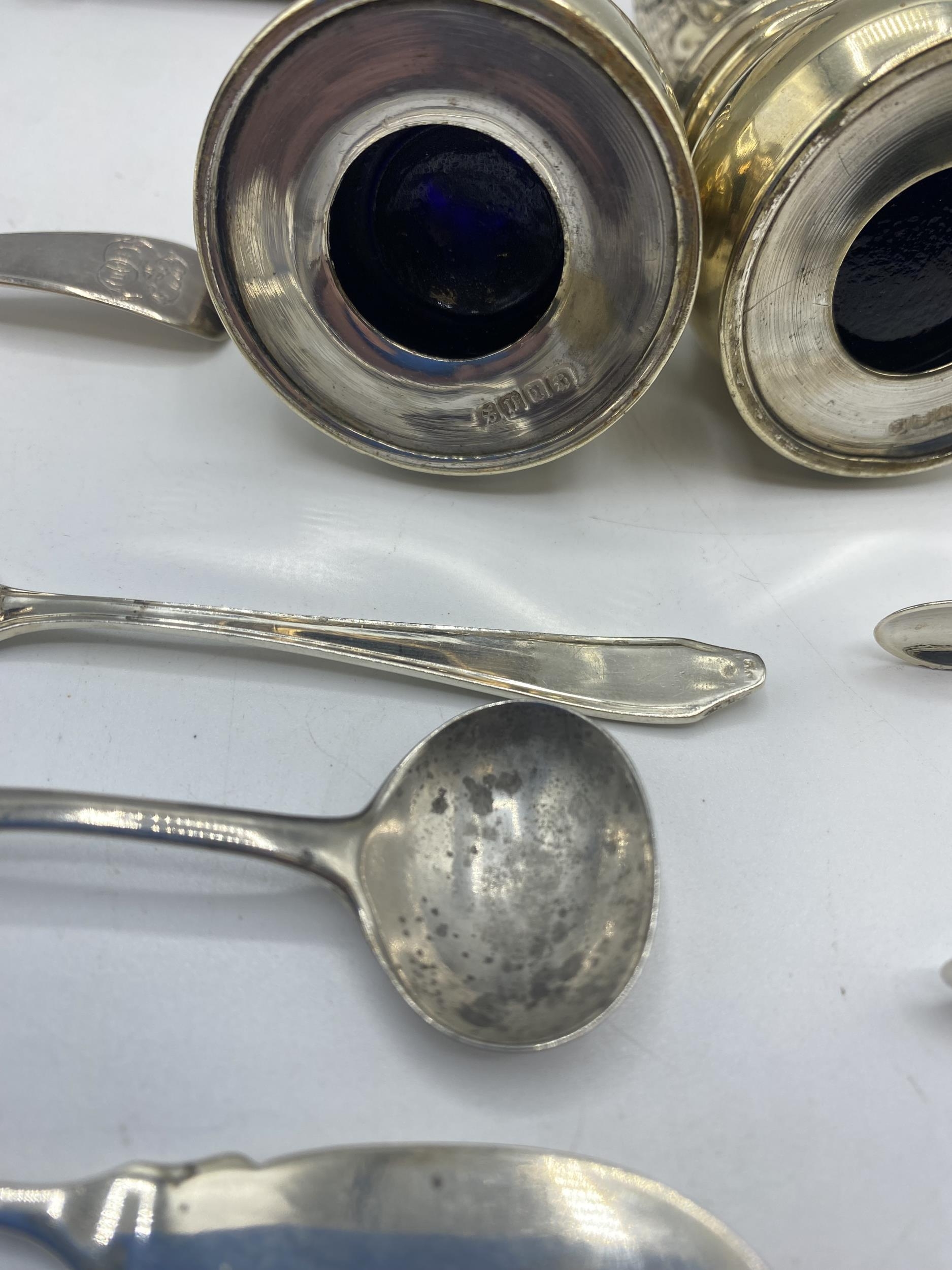 A collection of sterling silver items to include napkin rings , picture frames condiments etc. Gross - Image 7 of 15