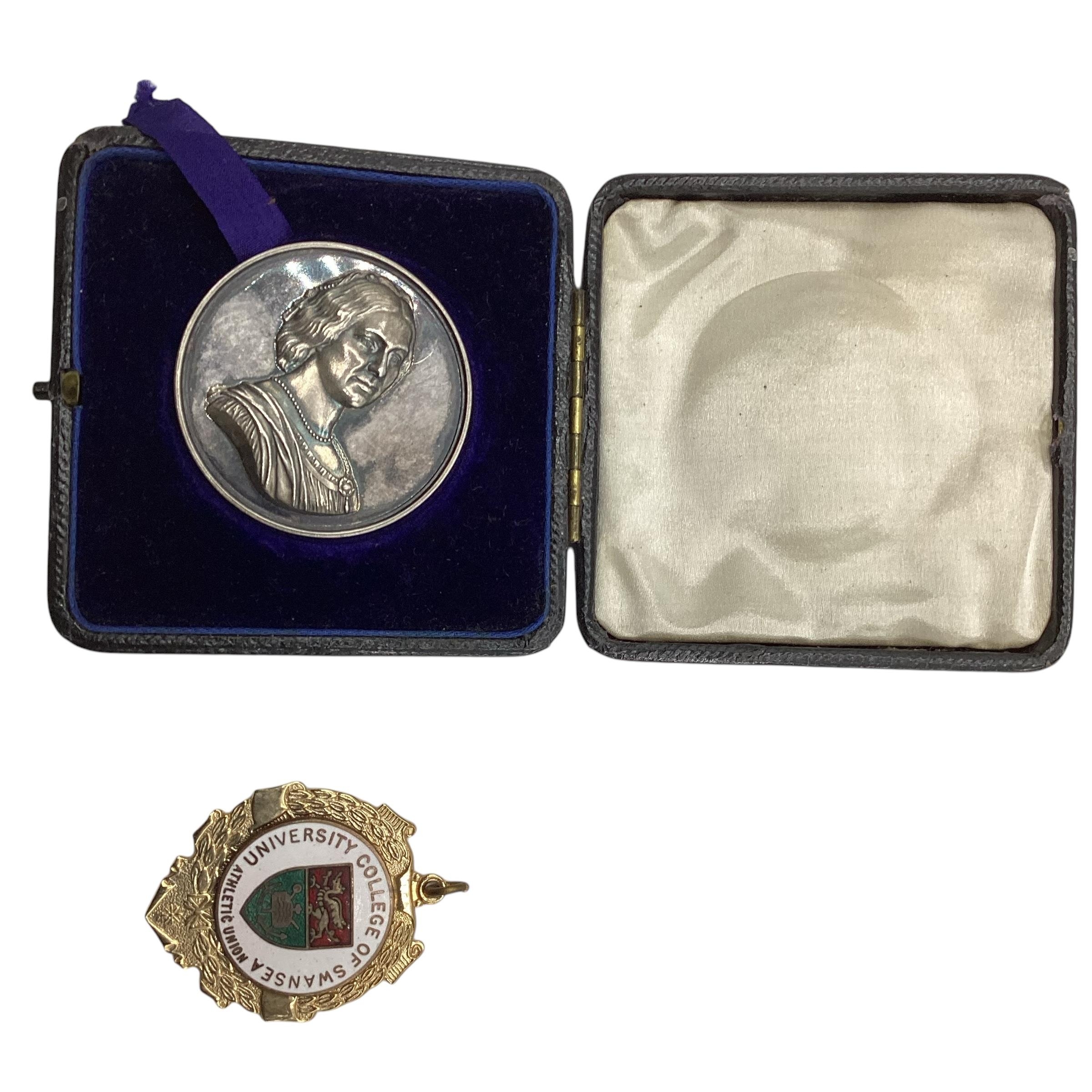 A cased coin, embossed to one side "The Mrs Sunderland Prize for Vocal Music" 1888, Rim: Hill