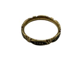 An unmarked yellow metal and black enamel mourning ring, marked CC to inside of hoop, Jane Goodear