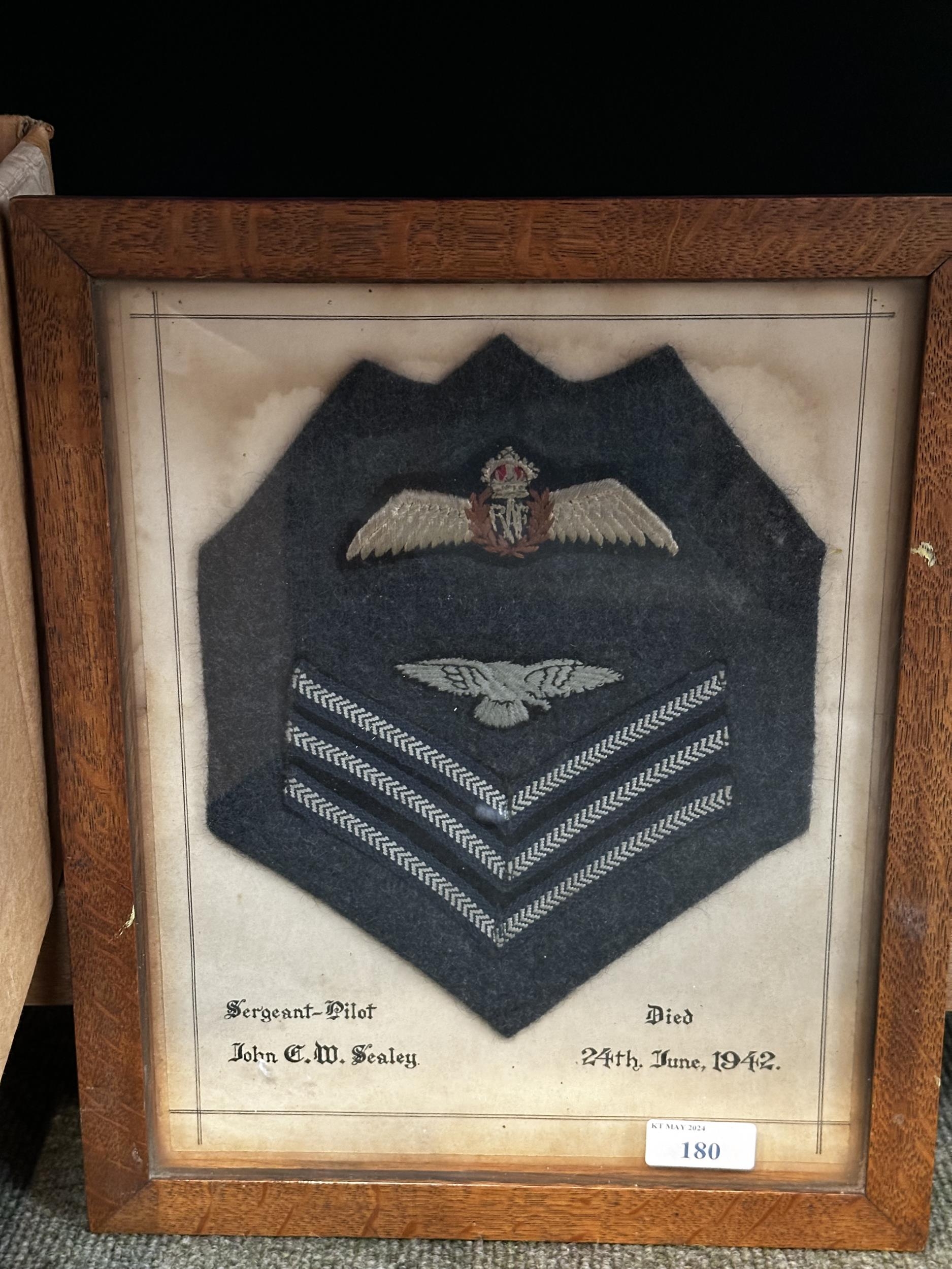 Cloth Insignia and patches for Sergeant Pilot John C W Sealey, died 24th June 1942, in a glazed