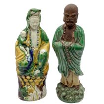Two Tang dynasty style polychrome glazed figures of Guanyin and immortal. Four character mark to