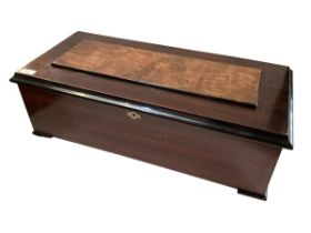 A C19th Swiss music box, in satinwood inlaid mahogany case, lists 20 song sheet to list, approx 58cm