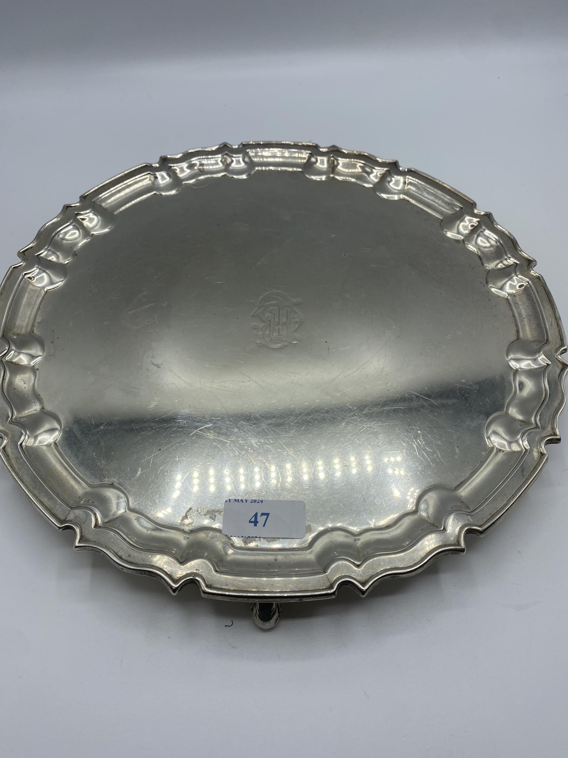 A sterling silver circular tray on three scroll feet by William Hutton and Sons Ltd, Sheffield 1922. - Image 10 of 10