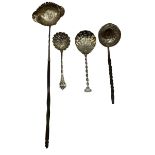 An unmarked white metal coin set toddy ladle with twisted horn/bone handle together with another